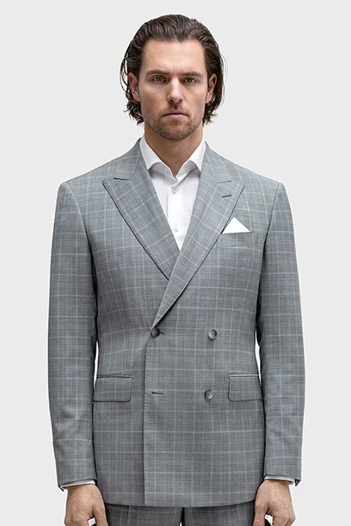 Man in a grey suit with light interwoven pattern, white shirt, and white pocket square.