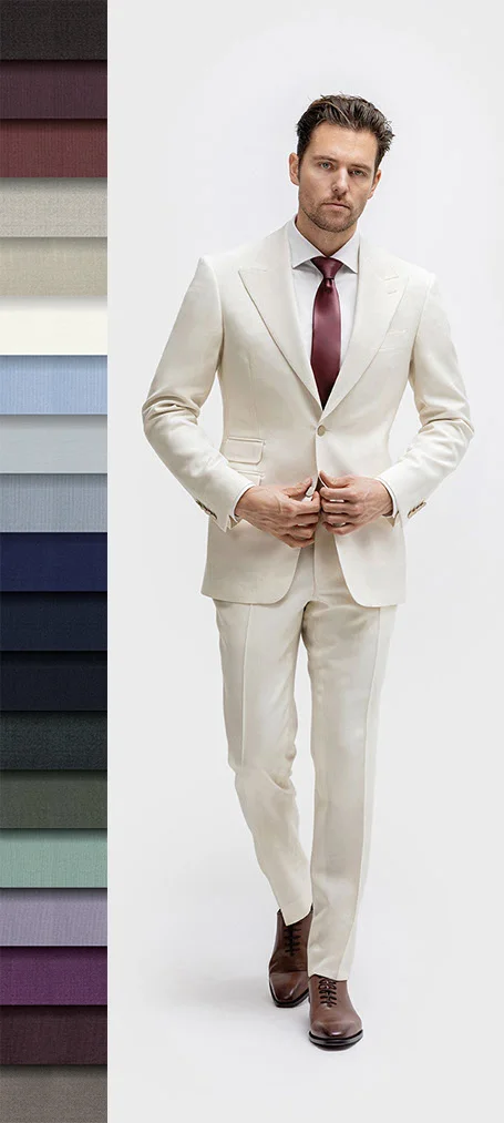 Model in beige suit with brown shoes, white shirt, and burgundy tie. Fabric swatches displayed vertically on the left side of the image.