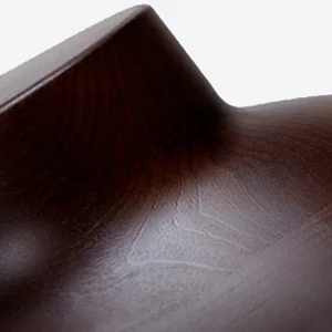Close-up of a wooden mannequin’s neck used for displaying suits.