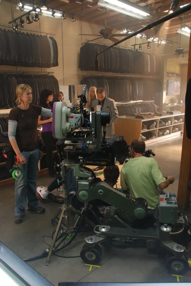 Camera on wheels and tracking rig inside ALANDALES store.