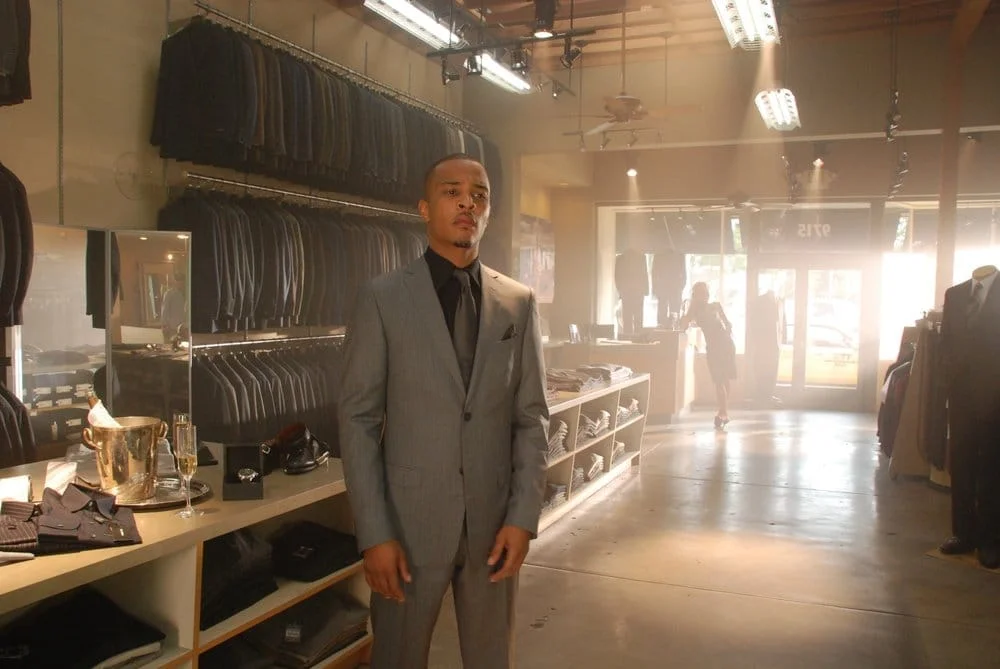 Rapper T.I. filming inside ALANDALES store in American shot.